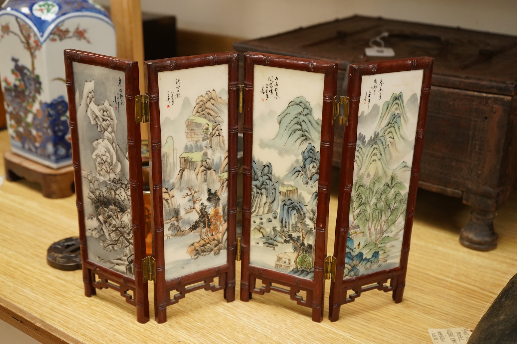 A Chinese cloisonné enamel ‘dragon’ jar and cover, a Chinese miniature four-fold table screen, two metalware tankards and a reproduction Japanese tsuba, cloisonne jar 9cm